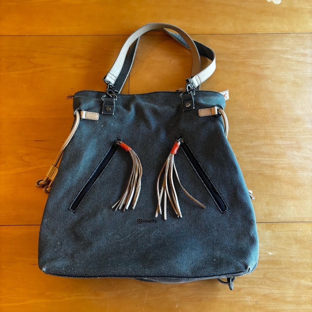 Sherpani women’s Tempest convertible backpack shoulder bag tassel detail